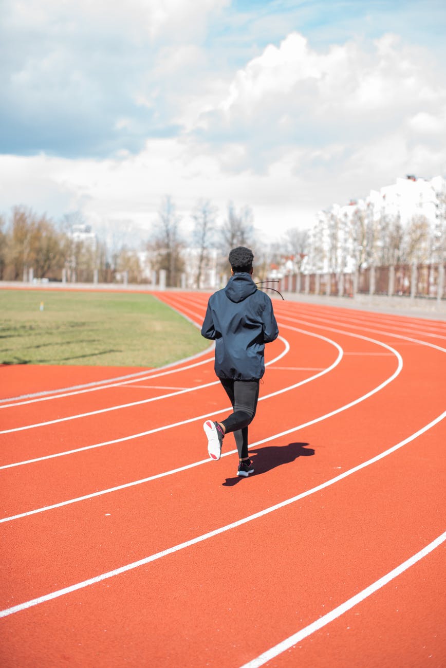 person running on track
